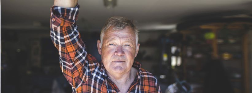 older man looking at camera